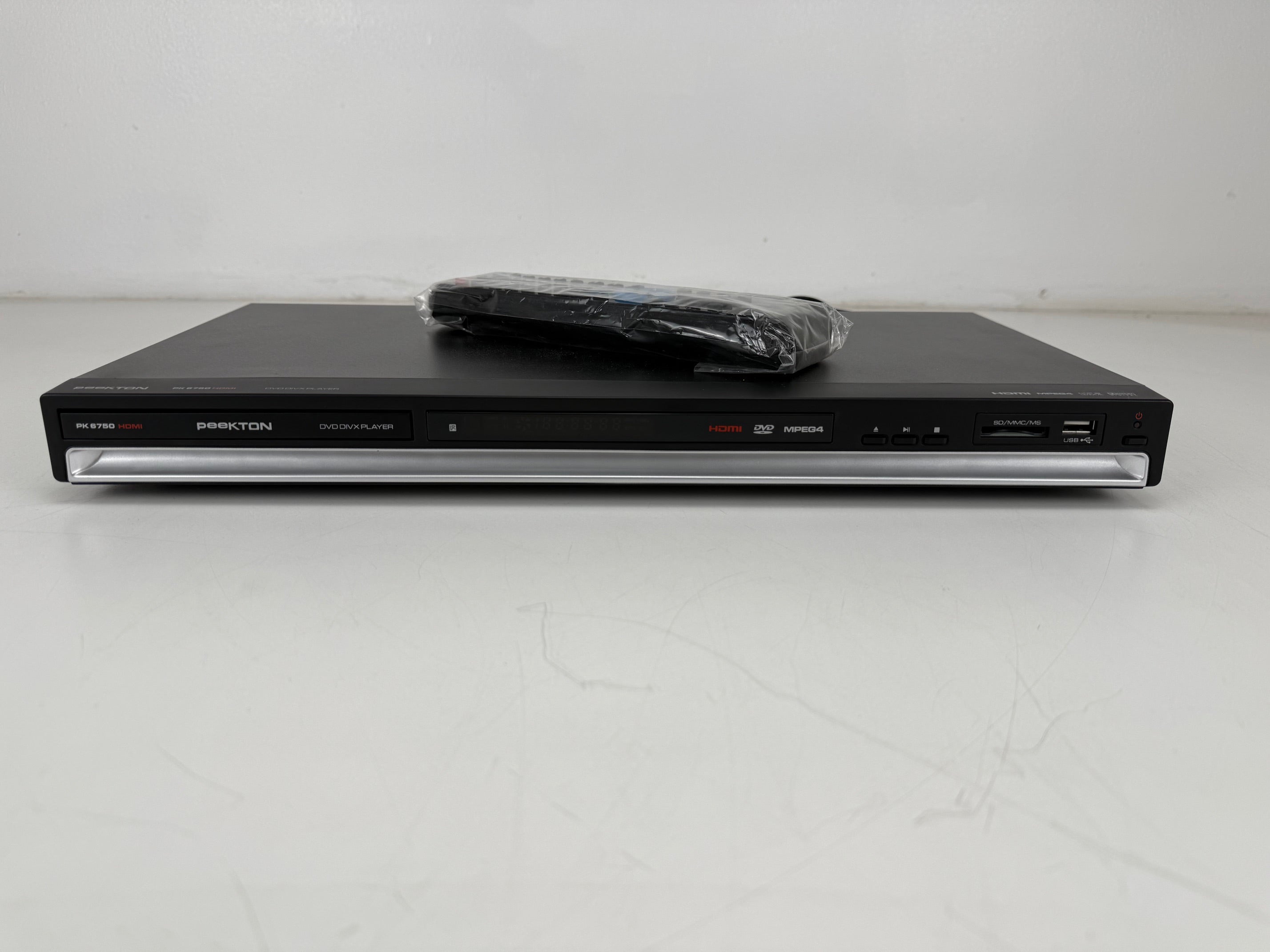 Onbekende PK 6750 HDMI DVD DIVX-speler met originele doos en afstandsbediening